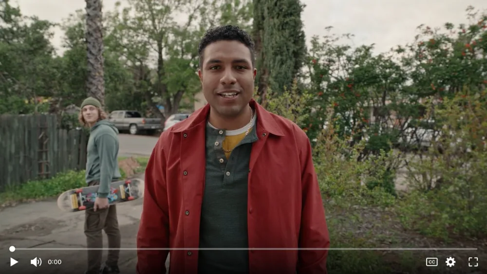 Youth standing with his friend in commercial